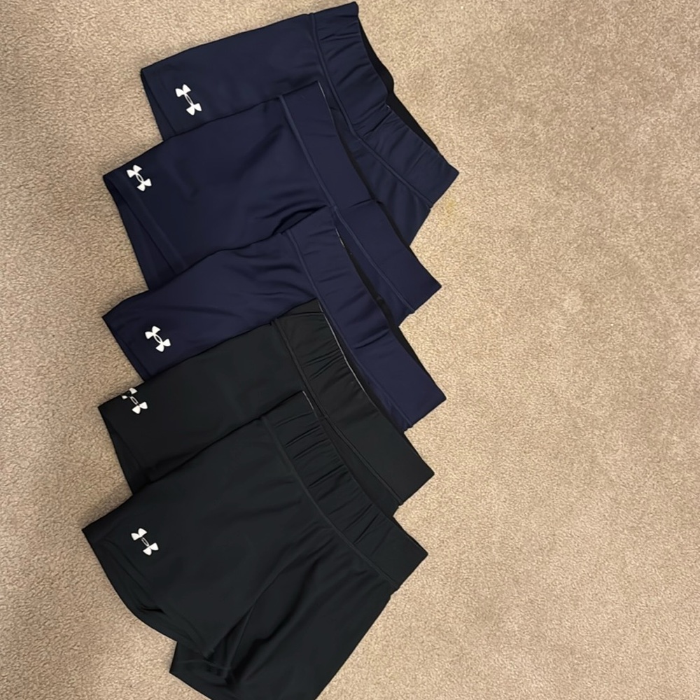 Under Armour spandex, three pairs of navy shorts and two pairs of black